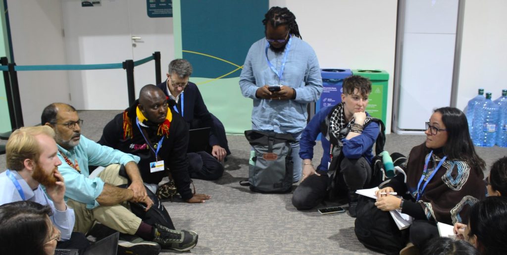 Bob and Nazeer attending participating in a session with the Human Rights working group – to gain a better understanding of COP29 processes. 